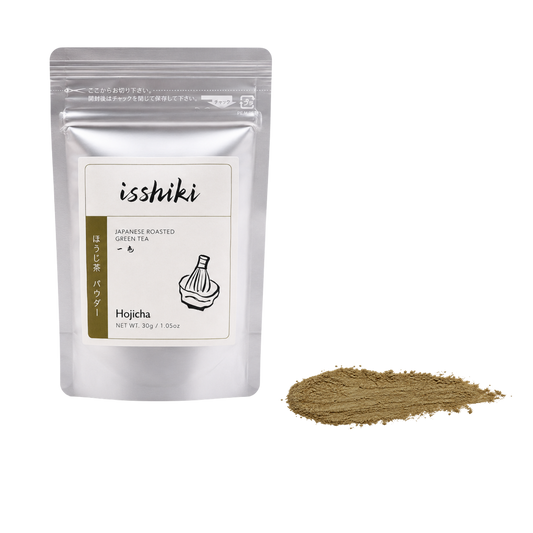 Isshiki Hojicha pouch beside a roasted brown Hojicha powder smear