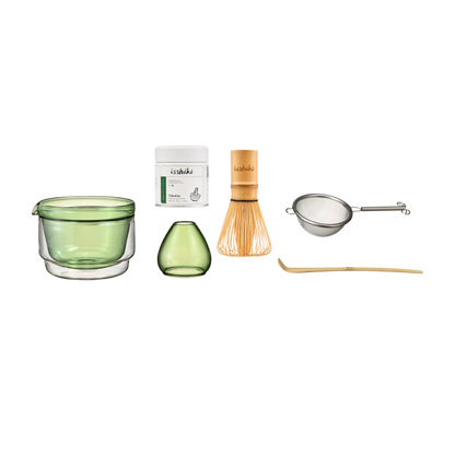 Isshiki x Hario set in green: glass bowl, matcha tin, bud vase, bamboo whisk, strainer, and bamboo scoop