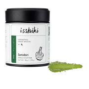 Isshiki Samidori matcha tin beside a green Samidori powder smear