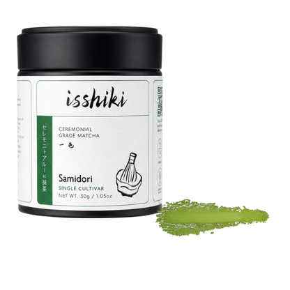 Isshiki Samidori matcha tin beside a green Samidori powder smear