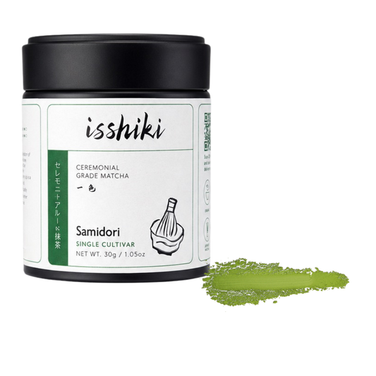 Isshiki Samidori matcha tin beside a green Samidori powder smear