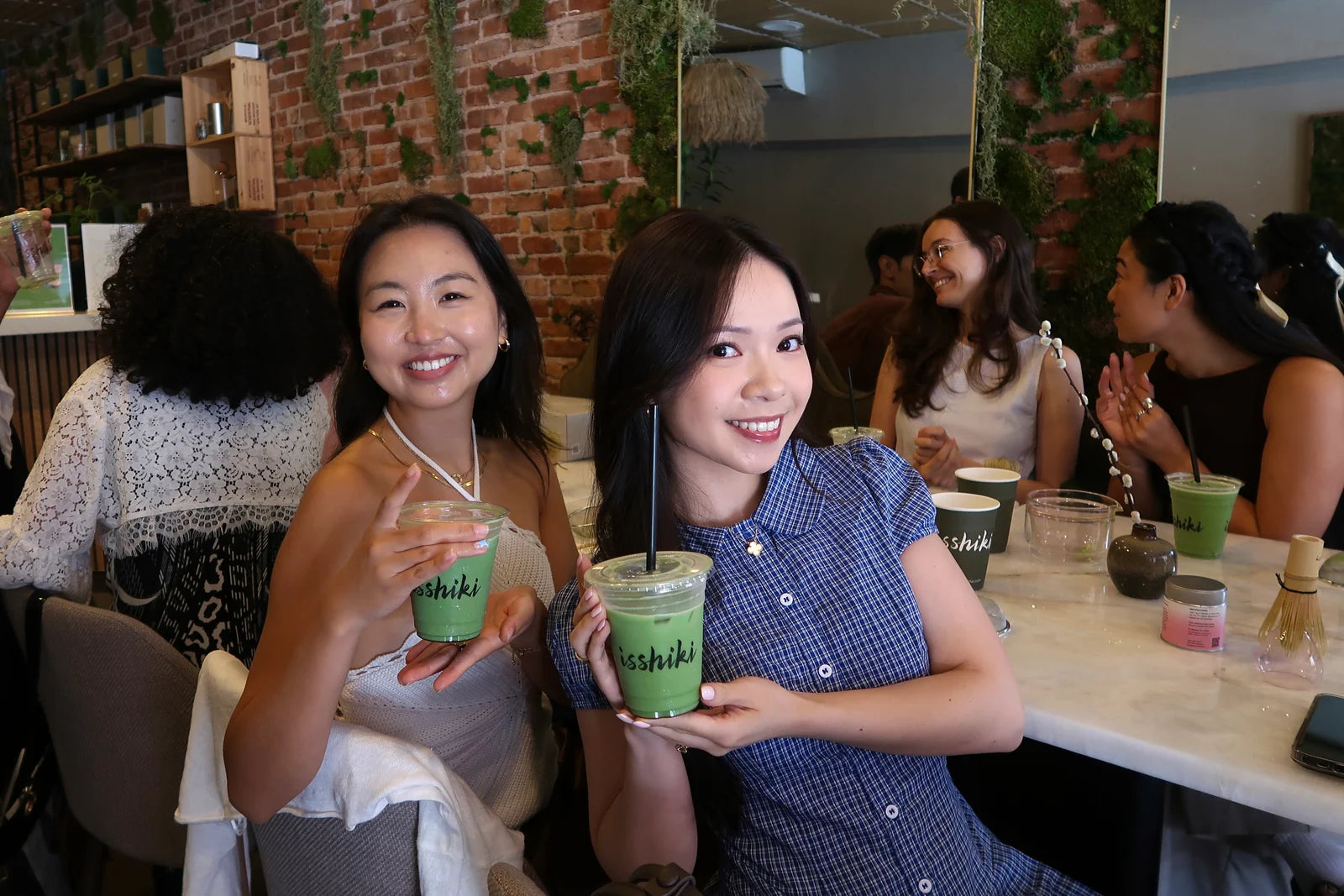 Guests enjoying matcha at an Isshiki café.